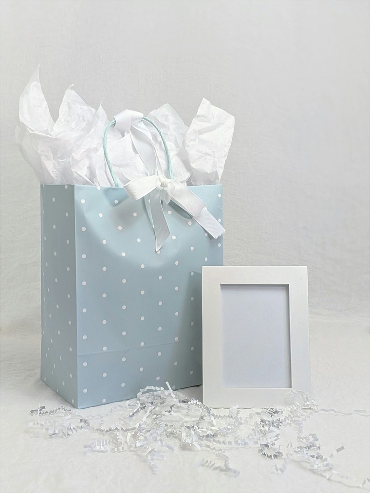 A small and beautiful paper bag with a silk handle